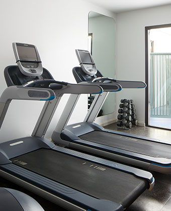 room with elliptical and treadmill